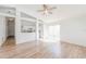 Bright living room with wood floors, ceiling fan, and sliding doors to the outdoors at 1073 Hamlet Dr, Maitland, FL 32751