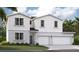 Two-story home with a three-car garage and a combination of siding and stucco exterior at 12915 Trovita Dr, Grand Island, FL 32735