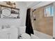 Bright bathroom featuring a shower over tub, modern shelving and vanity at 1397 Candlewyck Dr, Orlando, FL 32807