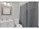 Clean bathroom with a shower, toilet, vanity, and a neutral color palette at 1397 Candlewyck Dr, Orlando, FL 32807