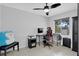 Well-lit bedroom with tile flooring and a large window offering a view of the outdoors at 1397 Candlewyck Dr, Orlando, FL 32807