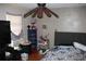 Bedroom featuring bed, dresser, and natural light at 14057 Ithaca Way, Orlando, FL 32826