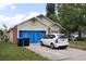Charming one-story home featuring light-colored siding, brick accents, and a front yard, offering curb appeal at 14057 Ithaca Way, Orlando, FL 32826