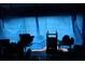 View of a storage area covered by a blue tarp at 14057 Ithaca Way, Orlando, FL 32826