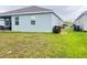 Well-maintained backyard with ample green space and a covered patio, offering outdoor enjoyment at 1412 Brentwood Dr, Kissimmee, FL 34746