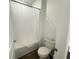 Clean bathroom with shower/tub combo and neutral wall and floor tiles at 1412 Brentwood Dr, Kissimmee, FL 34746