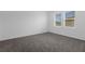 Bedroom with neutral carpeting and a window with blinds at 1412 Brentwood Dr, Kissimmee, FL 34746