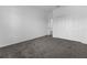 Cozy bedroom featuring plush gray carpeting and a double door closet at 1412 Brentwood Dr, Kissimmee, FL 34746