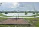 A community park with exercise equipment and a tranquil lake view, perfect for outdoor activities at 1412 Brentwood Dr, Kissimmee, FL 34746