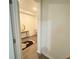 Entryway showing decorative rug, console table, and view into adjacent room at 1412 Brentwood Dr, Kissimmee, FL 34746