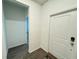 Neutral entryway featuring hard surface floors and an interior door at 1412 Brentwood Dr, Kissimmee, FL 34746