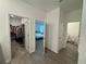 Hallway with view of the walk-in closet, main bedroom, and laundry room at 1412 Brentwood Dr, Kissimmee, FL 34746