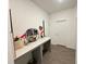 Hallway featuring an accent table and doorway access to other rooms at 1412 Brentwood Dr, Kissimmee, FL 34746