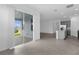 Open concept kitchen and living room with sliding glass doors to the outdoor patio at 1412 Brentwood Dr, Kissimmee, FL 34746