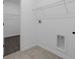 Utility room with washer and dryer hookups, and wire rack shelving at 1412 Brentwood Dr, Kissimmee, FL 34746