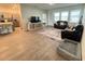 Open concept living room featuring tile flooring, comfortable seating, and access to the kitchen at 1412 Brentwood Dr, Kissimmee, FL 34746