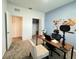 Home office featuring a desk and a large wall hanging at 1412 Brentwood Dr, Kissimmee, FL 34746