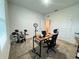 Spacious office with a large window, a desk and multiple chairs at 1412 Brentwood Dr, Kissimmee, FL 34746