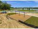 Aerial view of a neighborhood playground with swings and benches near the lake at 1412 Brentwood Dr, Kissimmee, FL 34746