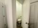 Clean toilet room with a closed-off toilet at 1412 Brentwood Dr, Kissimmee, FL 34746