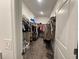 Large walk-in closet offering ample storage with organized shelving and hanging space at 1412 Brentwood Dr, Kissimmee, FL 34746