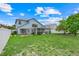 Large backyard with a well-maintained lawn, white fence, and enclosed patio at 1517 Abberton Dr, Orlando, FL 32837
