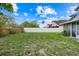 Spacious backyard with white vinyl fence, green grass, and potential for landscaping at 1517 Abberton Dr, Orlando, FL 32837