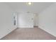 Empty bedroom featuring neutral walls and carpeting, with a bright window at 1517 Abberton Dr, Orlando, FL 32837