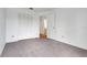 Bedroom featuring neutral carpeting, a closet and natural light from the doorway at 1517 Abberton Dr, Orlando, FL 32837
