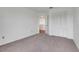 Carpeted bedroom featuring a closet and a view into the hallway at 1517 Abberton Dr, Orlando, FL 32837