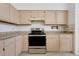 Bright kitchen featuring stainless steel oven and granite countertops with white cabinets at 1517 Abberton Dr, Orlando, FL 32837