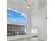 Bright living room with large windows, tile flooring, and neutral walls at 1517 Abberton Dr, Orlando, FL 32837