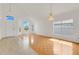 Bright living room with high ceilings, and beautiful hardwood floors with many windows at 1517 Abberton Dr, Orlando, FL 32837
