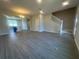 Open-concept living space featuring tile floors, stairs, and plenty of natural light at 15310 Burgtheater Dr, Winter Garden, FL 34787