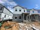 New two-story townhome featuring a modern design under construction with visible structural elements at 15363 Burgtheater Dr, Winter Garden, FL 34787