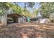 View of the property's various sheds and outbuildings, several with vehicle carports at 1860 Ne 62Nd St, Ocala, FL 34479