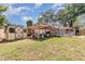 View of the property's sheds and outbuildings in the backyard at 1860 Ne 62Nd St, Ocala, FL 34479