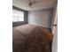 Comfortable bedroom with plush carpet and a ceiling fan, ensuring a relaxing and cozy atmosphere at 2202 Key West Ct # 633, Kissimmee, FL 34741