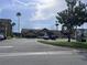 Resident clubhouse and amenities in a community with palm trees, lawns, and reserved parking at 2202 Key West Ct # 633, Kissimmee, FL 34741