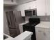 Kitchen with stainless steel refrigerator and microwave at 2202 Key West Ct # 633, Kissimmee, FL 34741