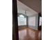 Bright living room with vaulted ceiling, large windows, and hardwood floors at 2202 Key West Ct # 633, Kissimmee, FL 34741