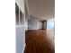 Spacious living area features sleek, dark wood-style flooring, offering a modern and stylish look at 2202 Key West Ct # 633, Kissimmee, FL 34741