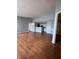 Open-concept living area with wood floors and access to the kitchen, offering a bright, airy space at 2202 Key West Ct # 633, Kissimmee, FL 34741