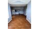 Spacious open-concept living room with hardwood floors leading into the kitchen at 2202 Key West Ct # 633, Kissimmee, FL 34741