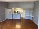 Open living area with hardwood floors and breakfast bar with bright natural light at 2202 Key West Ct # 633, Kissimmee, FL 34741