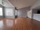 Bright living room with light gray walls and modern wood floors, creating a spacious and inviting atmosphere at 2202 Key West Ct # 633, Kissimmee, FL 34741