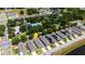 Community aerial view showcasing a lake, sidewalks, trees, and neatly arranged homes at 2340 Grasmere View S Pkwy, Kissimmee, FL 34746