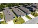 Aerial view of single-Gathering homes in a neighborhood featuring modern roofing and well-kept lawns at 2340 Grasmere View S Pkwy, Kissimmee, FL 34746