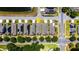 An aerial view of single-Gathering homes in a community neighborhood with tree-lined streets at 2340 Grasmere View S Pkwy, Kissimmee, FL 34746