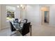 Dining room filled with light, and a view out to the front yard at 2340 Grasmere View S Pkwy, Kissimmee, FL 34746